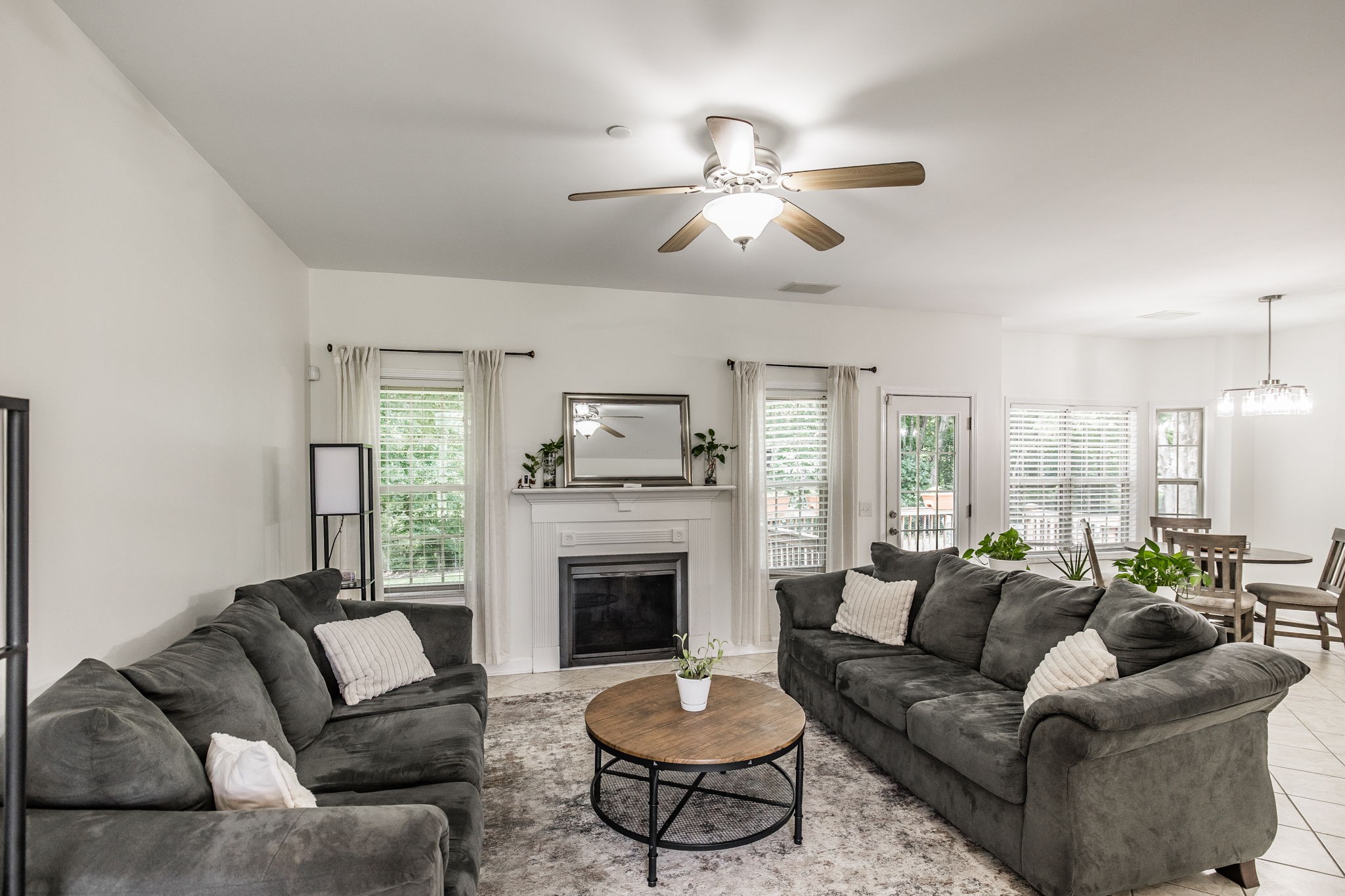 2860 Morgan Road Joelton, TN 37080 - Photo 3 of 45 a living room with furniture a fireplace and a large window