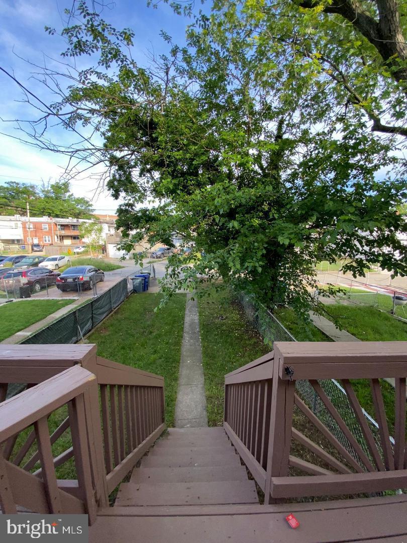 41 North Kossuth Street Baltimore, MD 21229 - Photo 12 of 30 a view of backyard with deck and outdoor seating