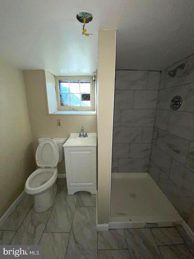 41 North Kossuth Street Baltimore, MD 21229 - Photo 15 of 30 a bathroom with a toilet and a shower