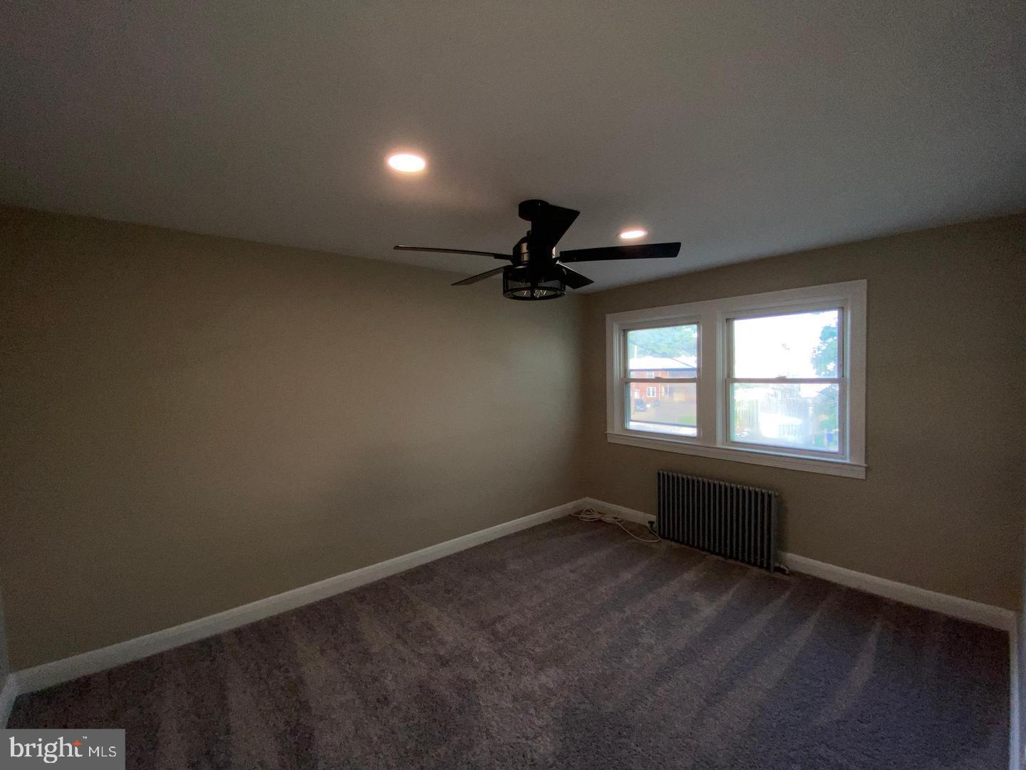 41 North Kossuth Street Baltimore, MD 21229 - Photo 19 of 30 an empty room with a empty space and windows