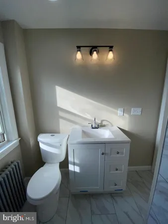 a bathroom with a sink and shower