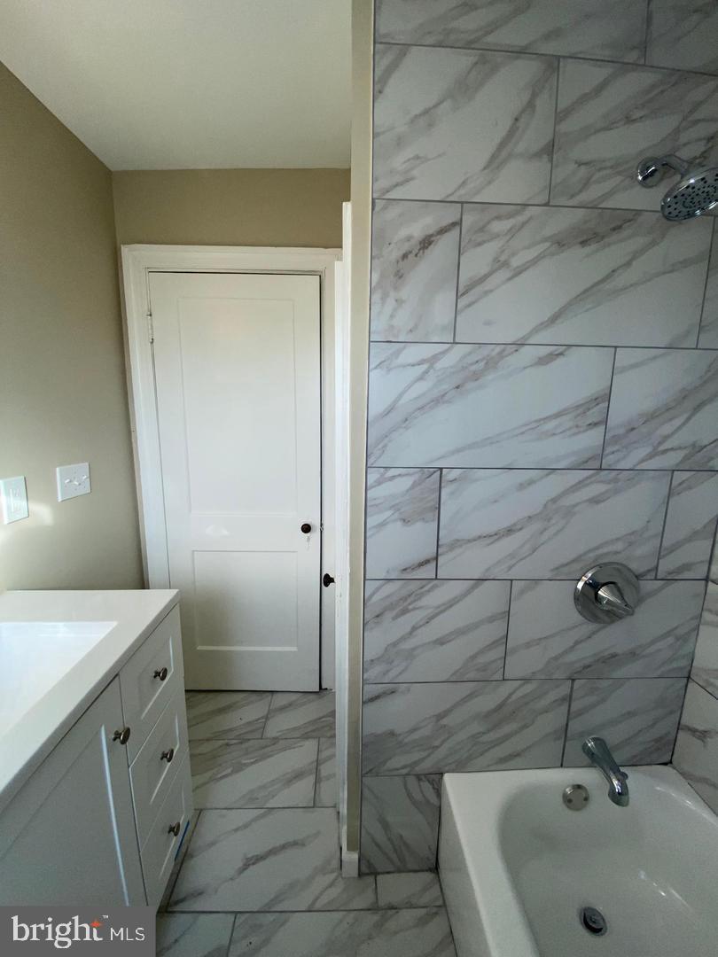 41 North Kossuth Street Baltimore, MD 21229 - Photo 27 of 30 a bathroom with a sink and shower