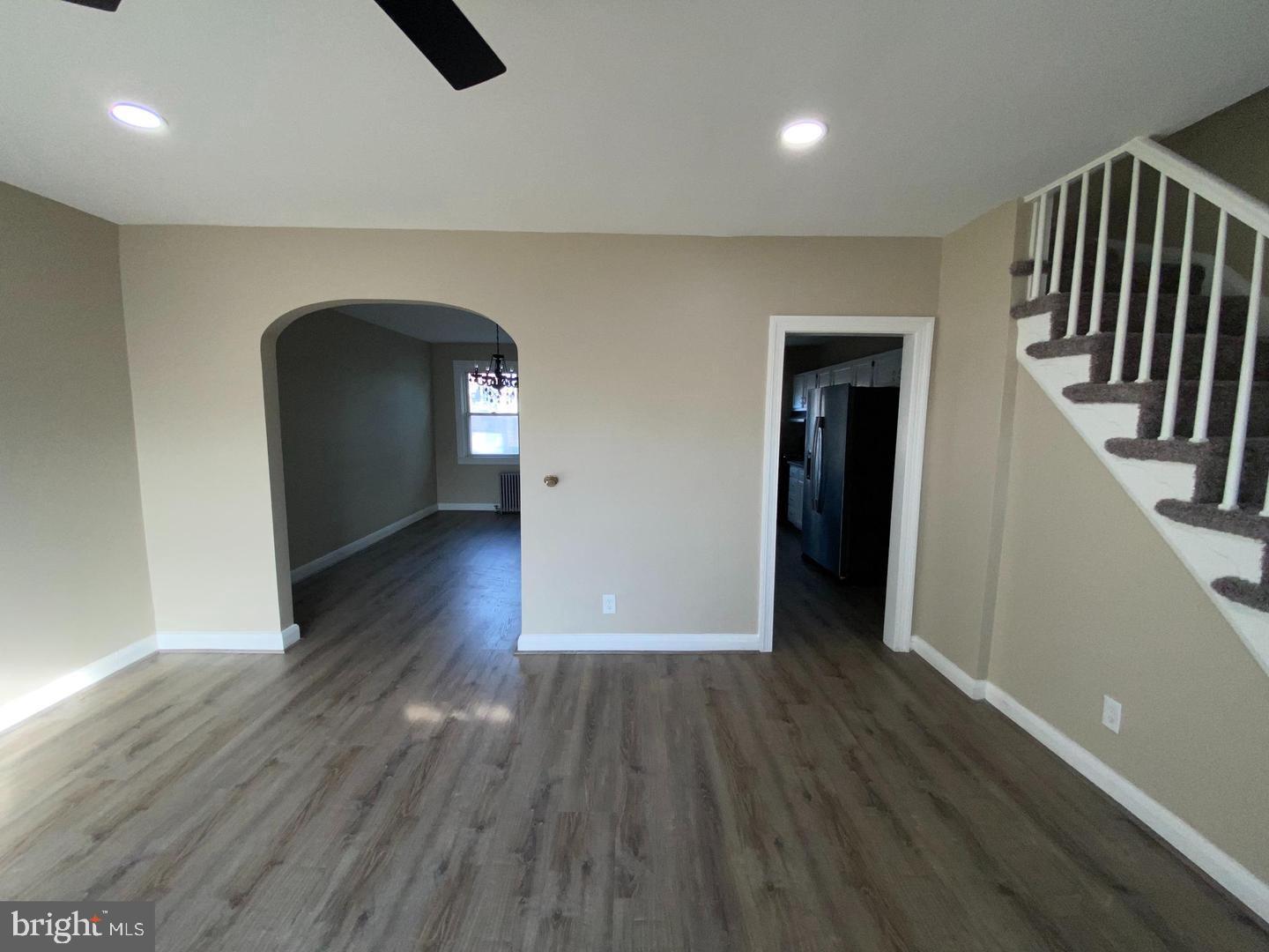 41 North Kossuth Street Baltimore, MD 21229 - Photo 4 of 30 wooden floor in a hall with a window