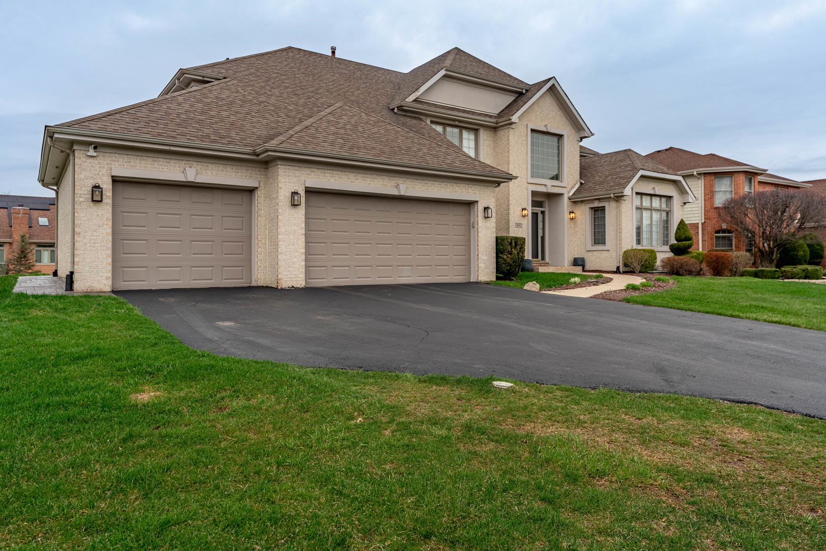 1442 Kinross Street Flossmoor, IL 60422 - Photo 2 of 53 a front view of a house with a garden and garage
