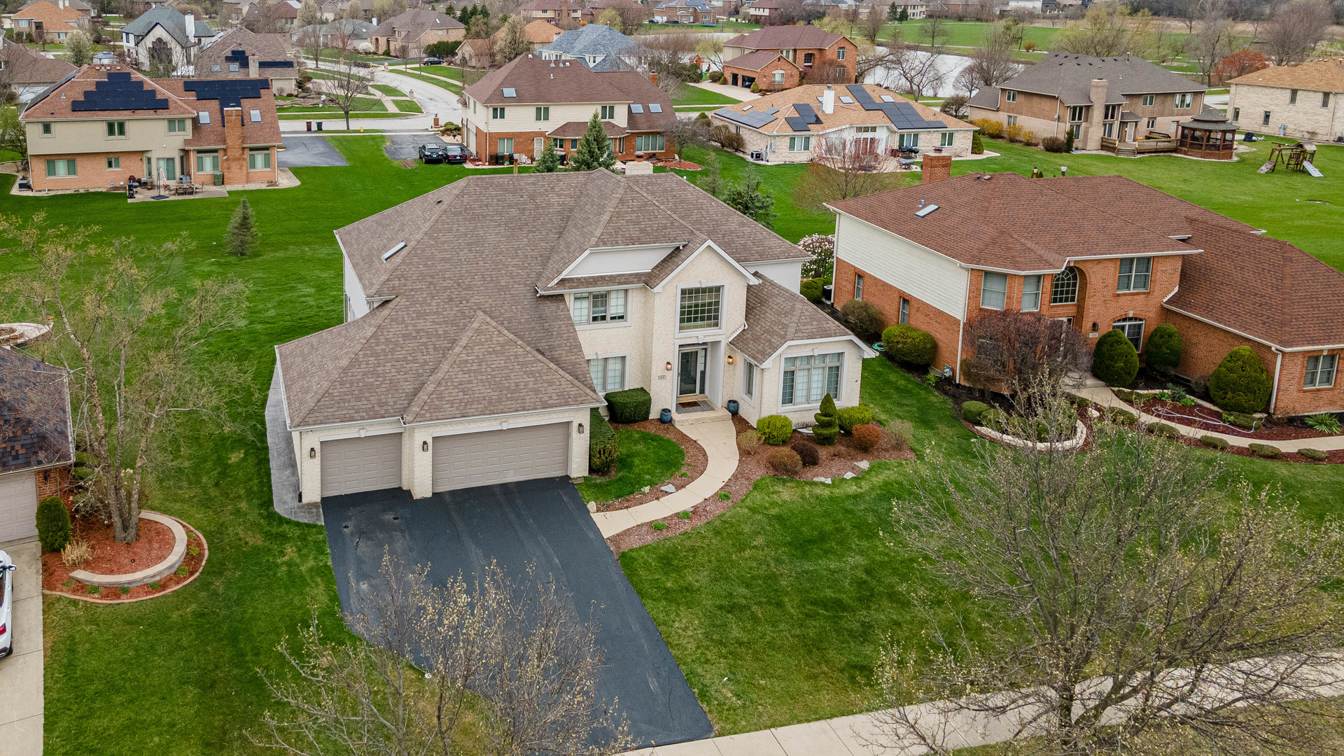 1442 Kinross Street Flossmoor, IL 60422 - Photo 4 of 53 an aerial view of a house with swimming pool and a yard