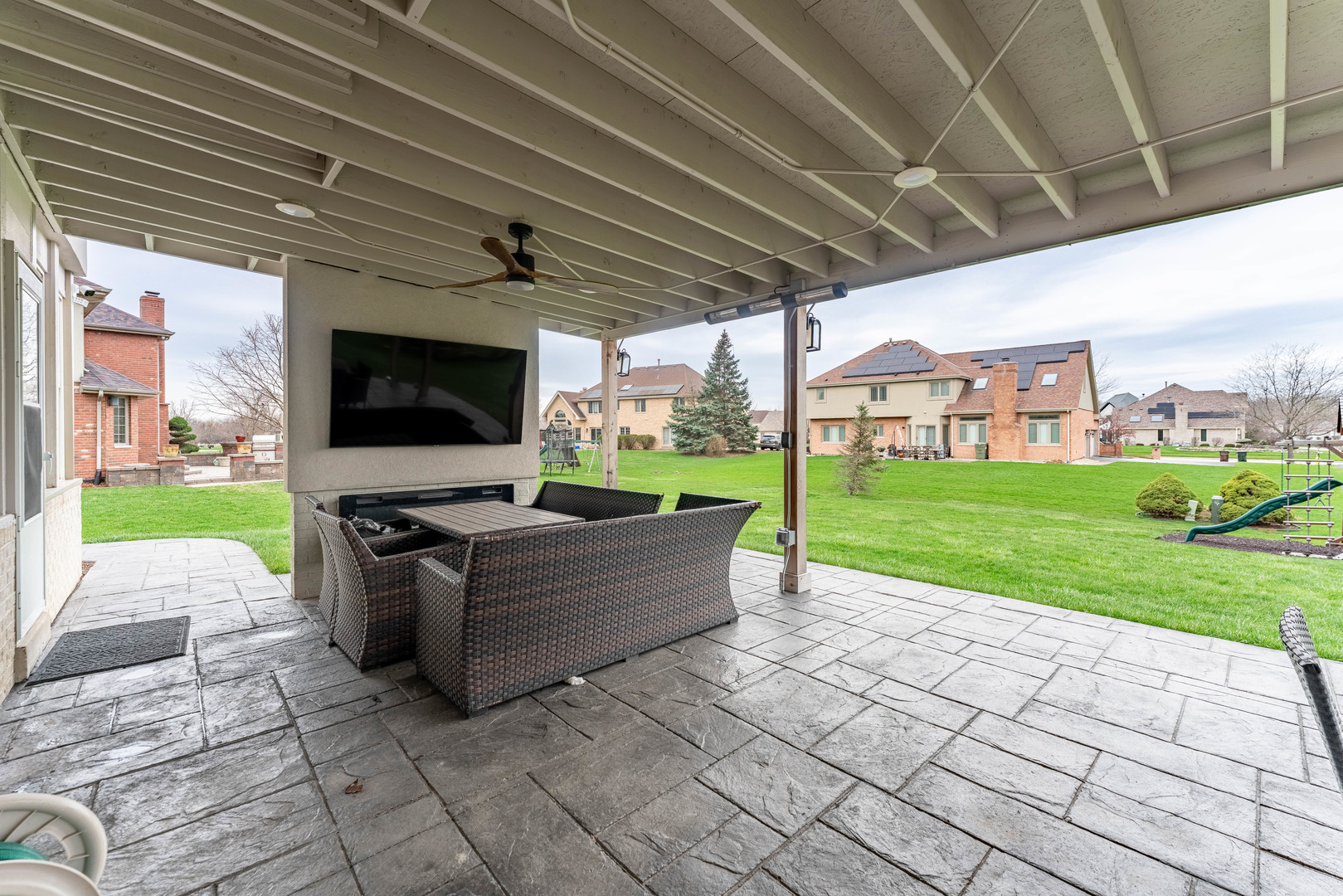 1442 Kinross Street Flossmoor, IL 60422 - Photo 44 of 53 a living room with patio furniture and a flat screen tv