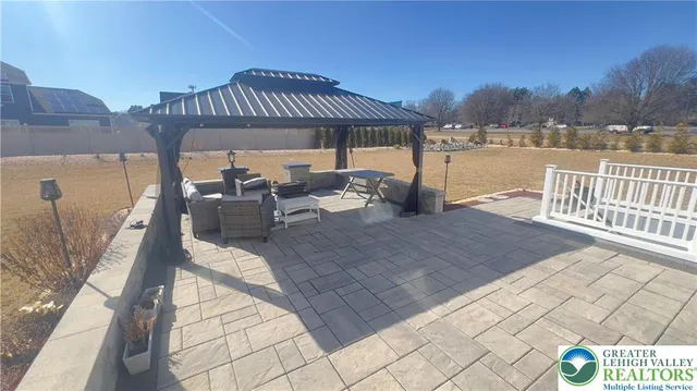 a large house with a big yard and large trees