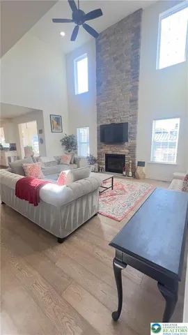 a bedroom with a bed and a fireplace