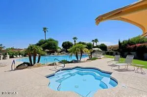 a view of a swimming pool with a patio
