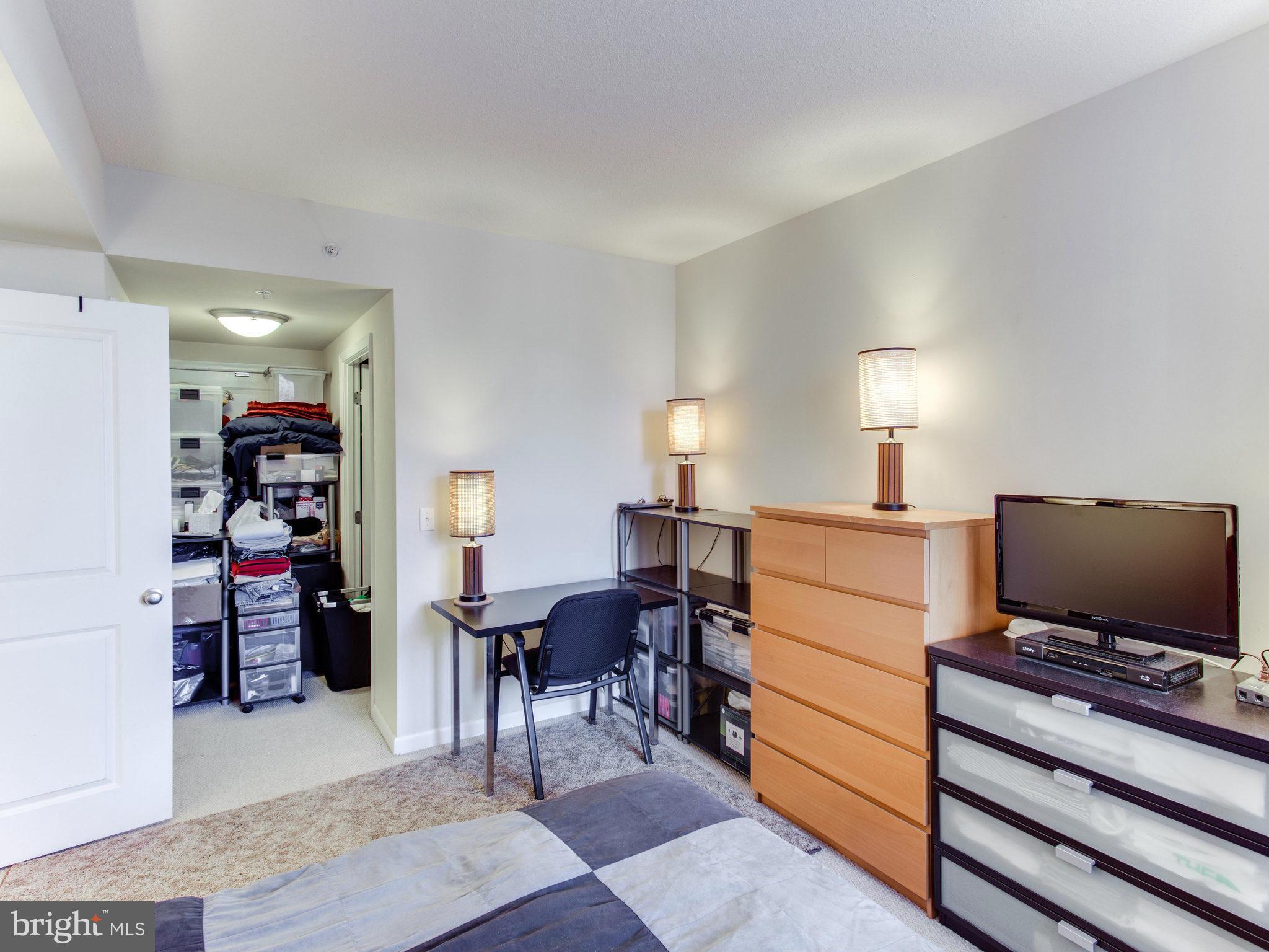 851 North Glebe Road, Unit 403 Arlington, VA 22203 - Photo 12 of 28 a room with furniture and a flat screen tv