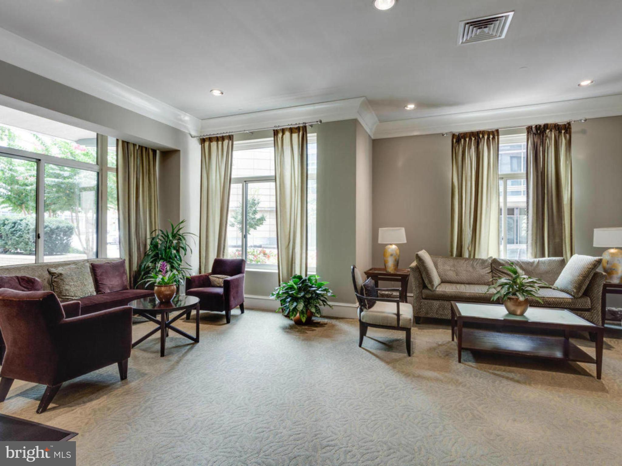 851 North Glebe Road, Unit 403 Arlington, VA 22203 - Photo 15 of 28 a living room with furniture and floor to ceiling window
