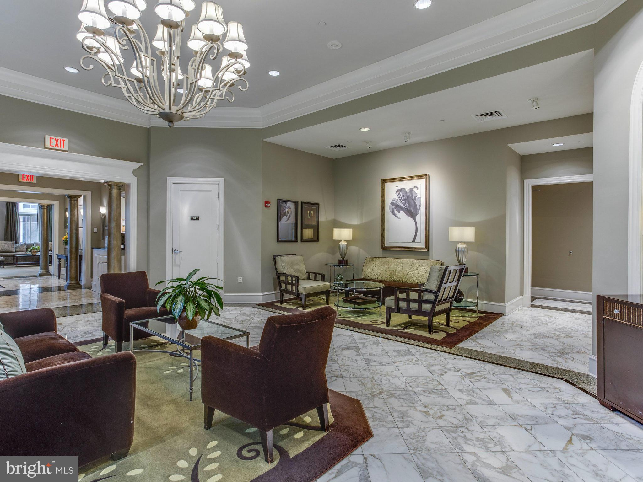 851 North Glebe Road, Unit 403 Arlington, VA 22203 - Photo 16 of 28 a living room with furniture and a chandelier