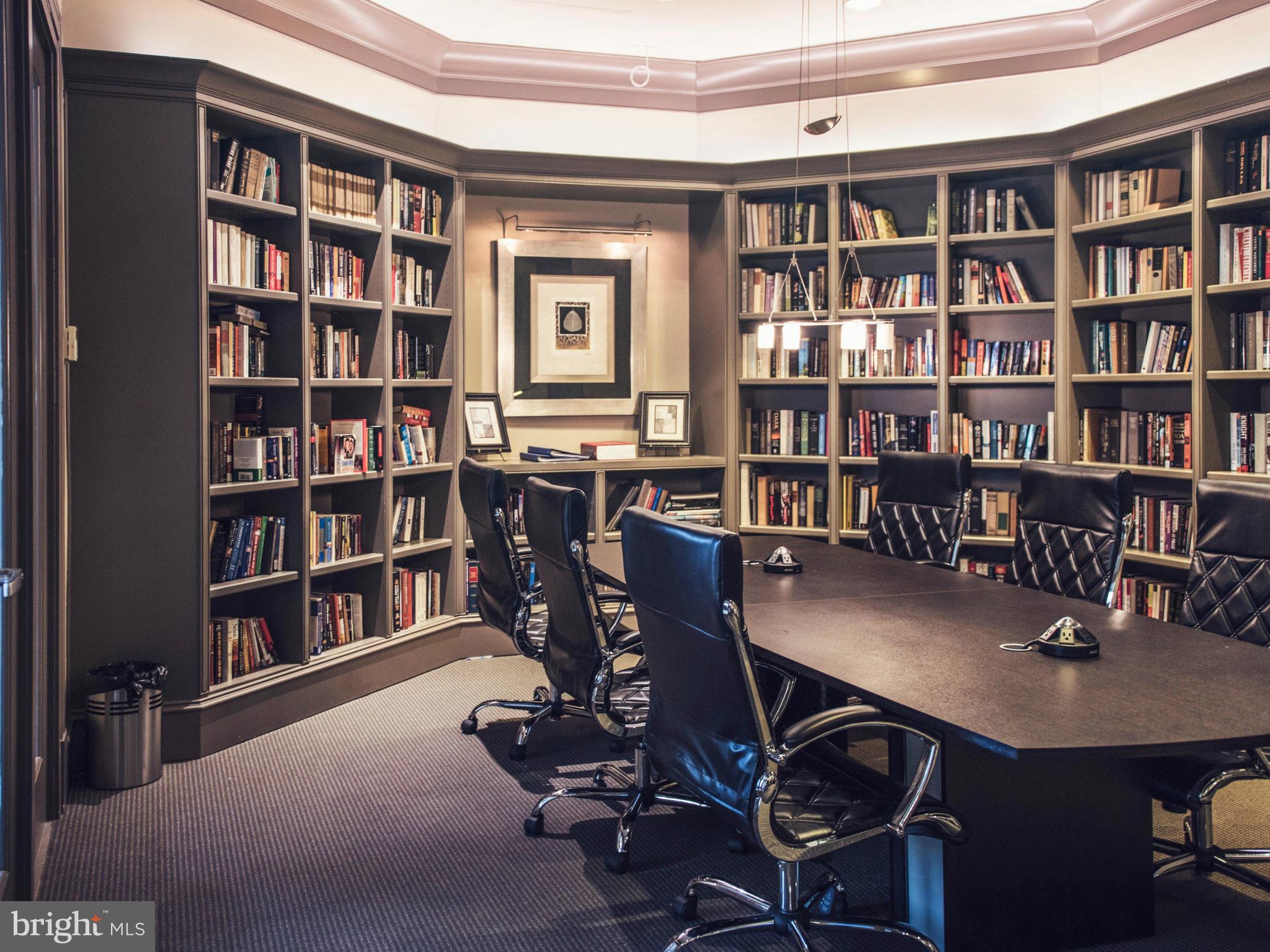 851 North Glebe Road, Unit 403 Arlington, VA 22203 - Photo 19 of 28 a view of a workspace with furniture and a bookshelf