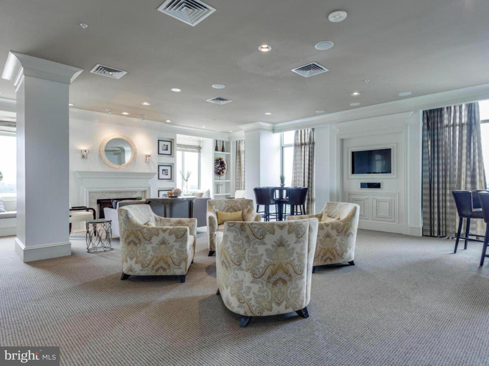 851 North Glebe Road, Unit 403 Arlington, VA 22203 - Photo 26 of 28 a living room with furniture and a flat screen tv