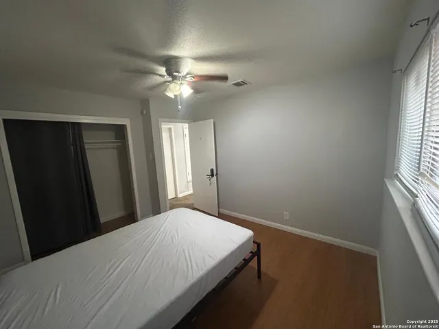 a room with a bed and a chandelier