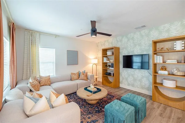 a living room with furniture and a table