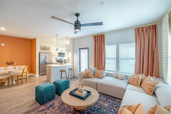 a living room with furniture and a large window