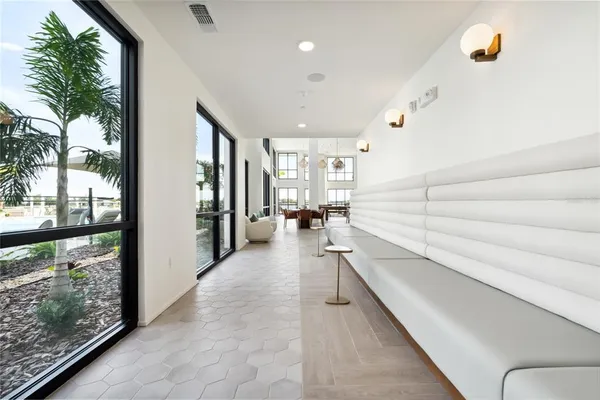 a kitchen with a refrigerator a oven and white cabinets