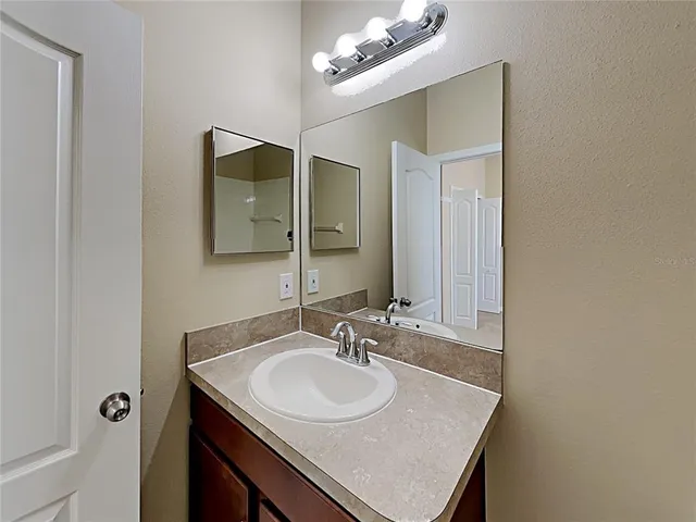 a bathroom with a sink and a mirror