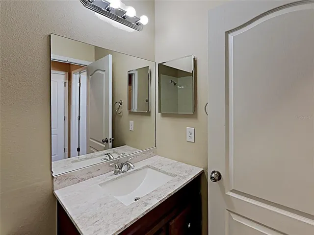 a bathroom with a sink and a mirror
