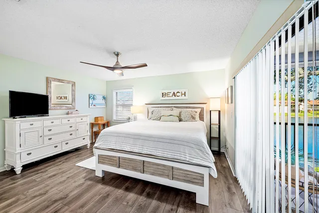 a bedroom with a bed and flat screen tv