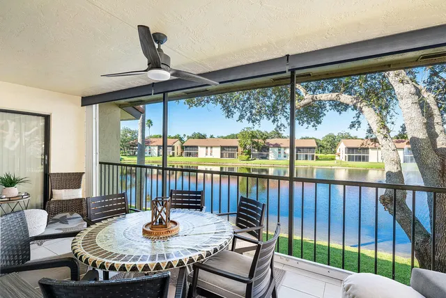 a dining room with furniture a chandelier and pool table