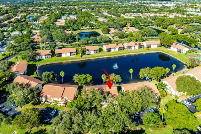 an aerial view of a house with a swimming pool