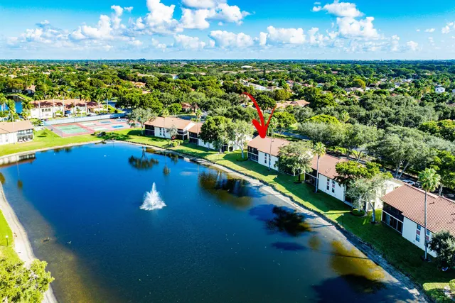 a view of a golf course with an ocean