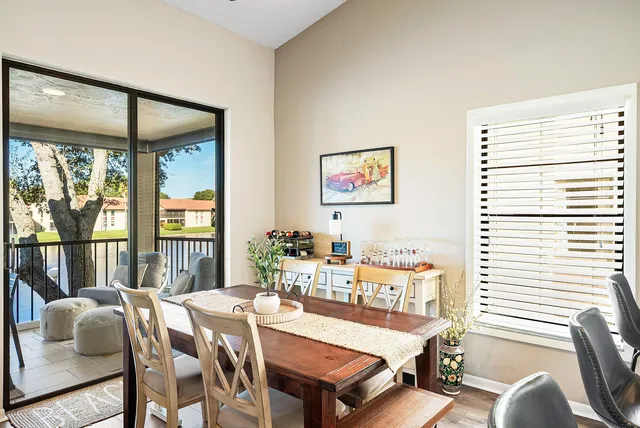a view of a dining room with furniture window and outside view
