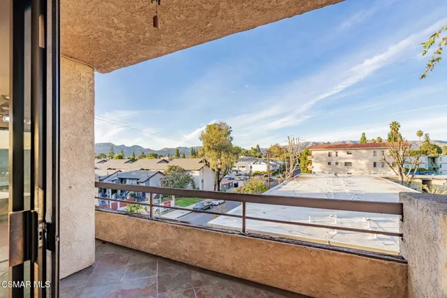 a view of a balcony with city view