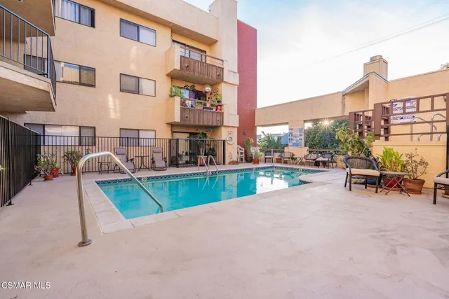 a view of a chairs and table in the patio