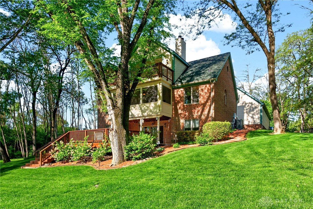330 South Alpha Bellbrook Road Bellbrook, OH 45305 - Photo 57 of 87 This charming home offers a serene escape with its lush yard and inviting outdoor spaces.