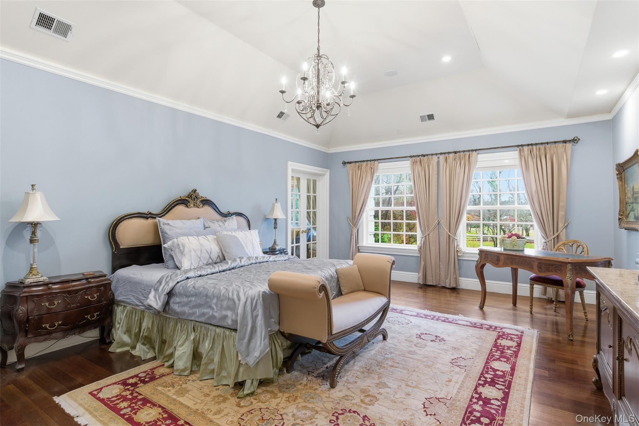 35 Chicken Valley Road Glen Head, NY 11545 - Photo 14 of 47 a bedroom with a bed a large window and a couch