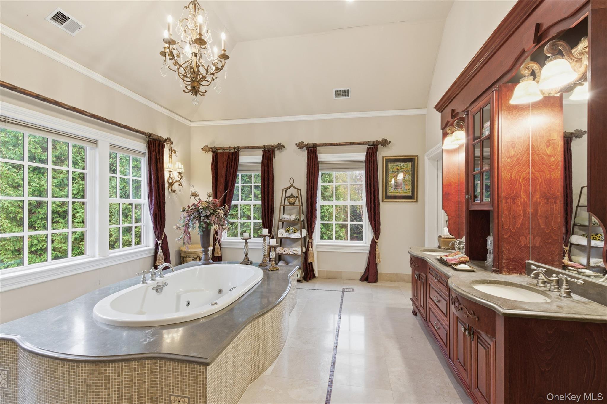 35 Chicken Valley Road Glen Head, NY 11545 - Photo 17 of 47 a spacious bathroom with a tub a sink and large windows