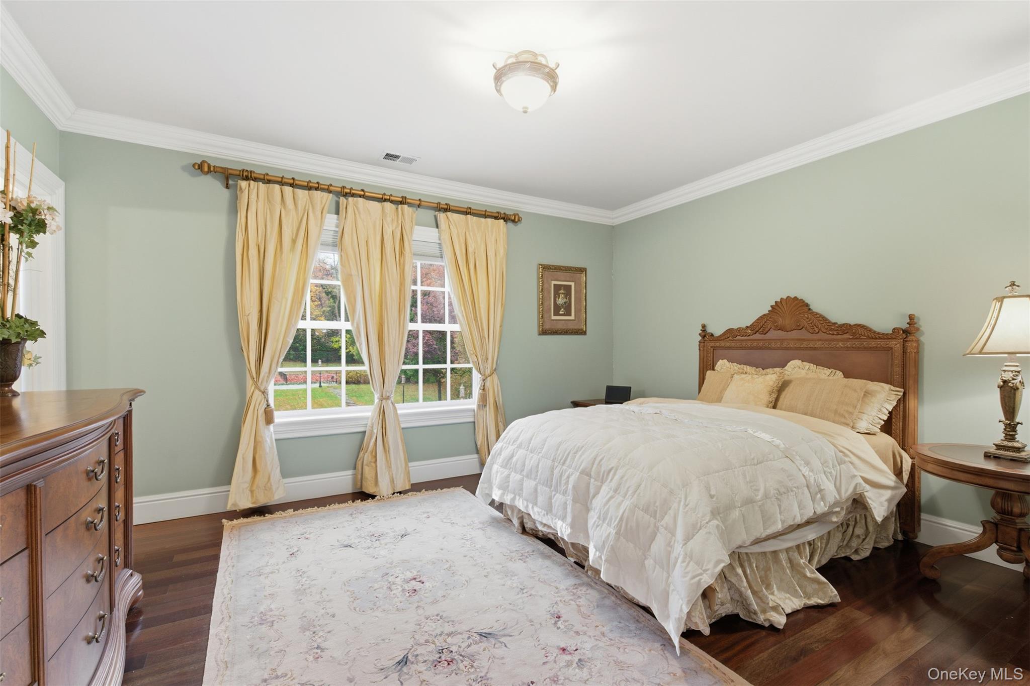 35 Chicken Valley Road Glen Head, NY 11545 - Photo 19 of 47 a bedroom with a bed and a dresser next to a window