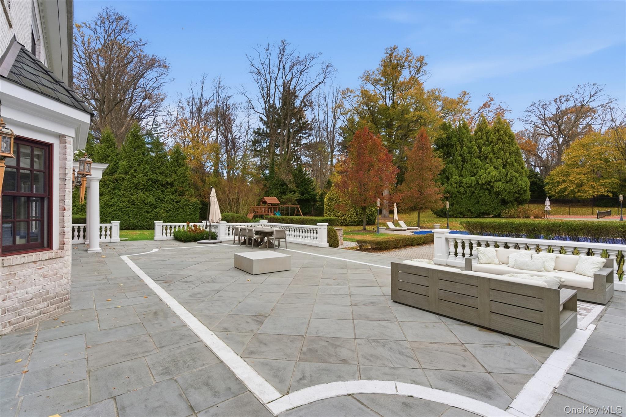 35 Chicken Valley Road Glen Head, NY 11545 - Photo 34 of 47 a view of swimming pool with chairs and trees
