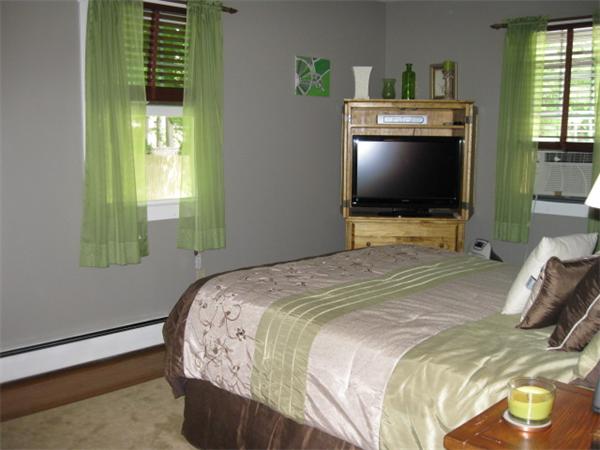 15 Joseph Street Acushnet, MA 02743 - Photo 11 of 22 a bedroom with a bed and a flat tv screen on dresser