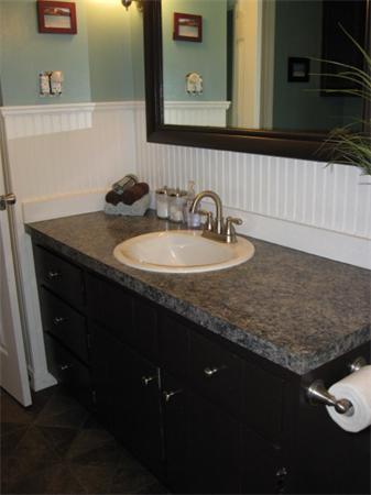 15 Joseph Street Acushnet, MA 02743 - Photo 15 of 22 a bathroom with a granite countertop sink a mirror and vanity