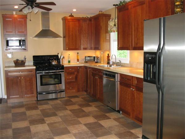 15 Joseph Street Acushnet, MA 02743 - Photo 3 of 22 a kitchen with stainless steel appliances granite countertop a stove a sink and a refrigerator