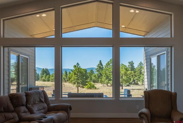 a living room with furniture and windows