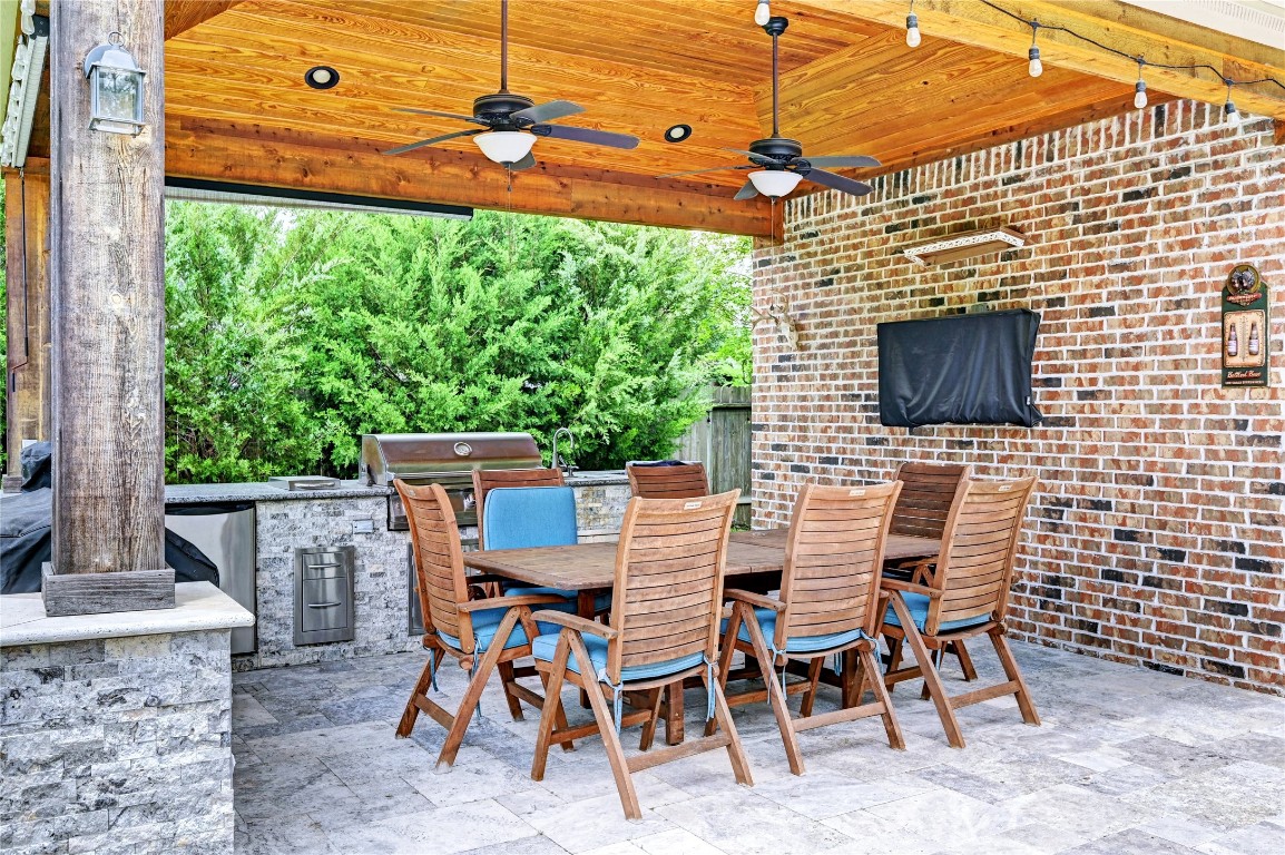 335 Fox Trail Road Montgomery, TX 77316 - Photo 26 of 47 Host and entertain with this brick cabana with outdoor seating with a summer kitchen and a half bath just right beside the pool.