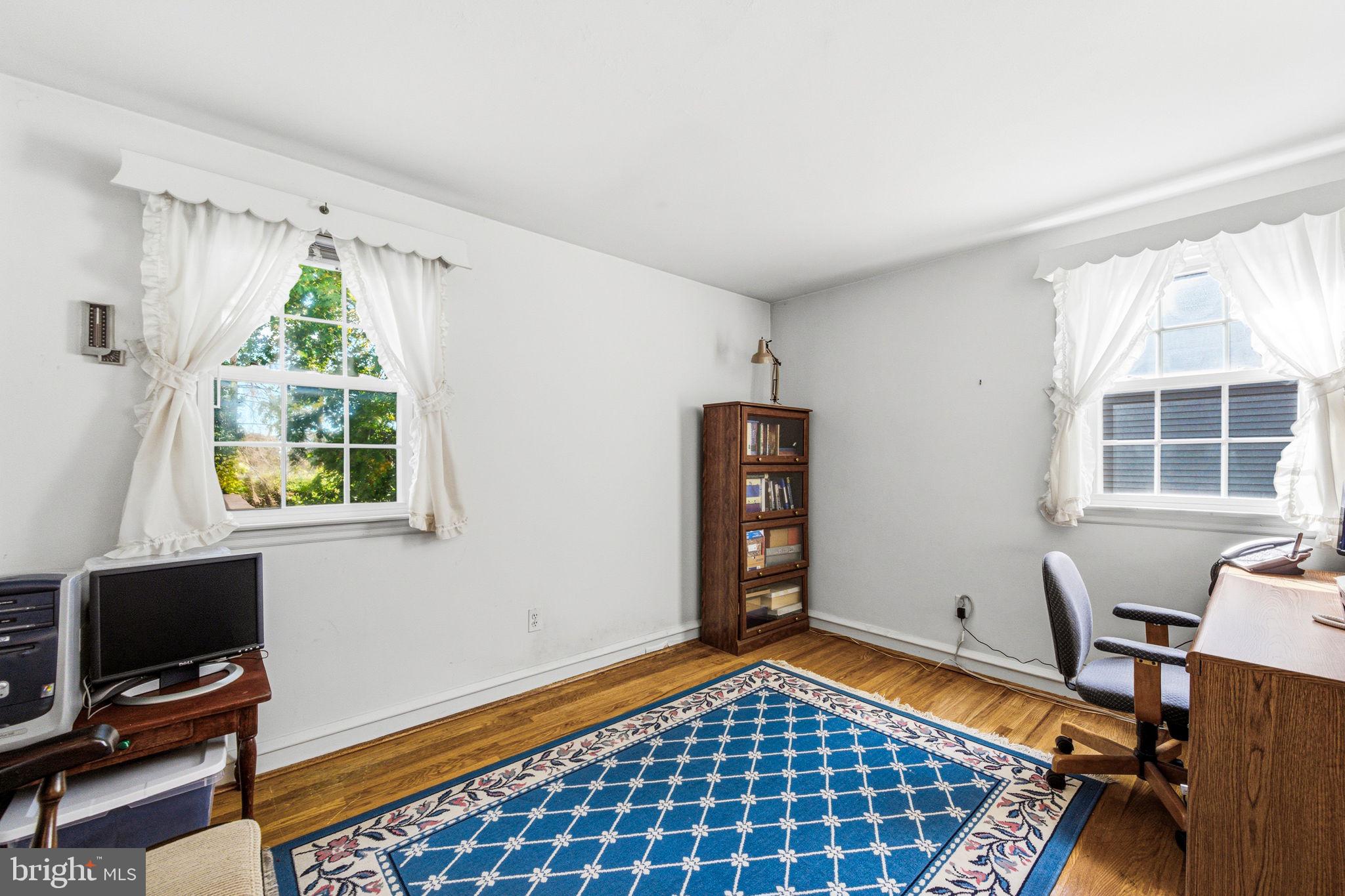 247 Orchard Road Springfield, PA 19064 - Photo 14 of 30 a bedroom with furniture and a window