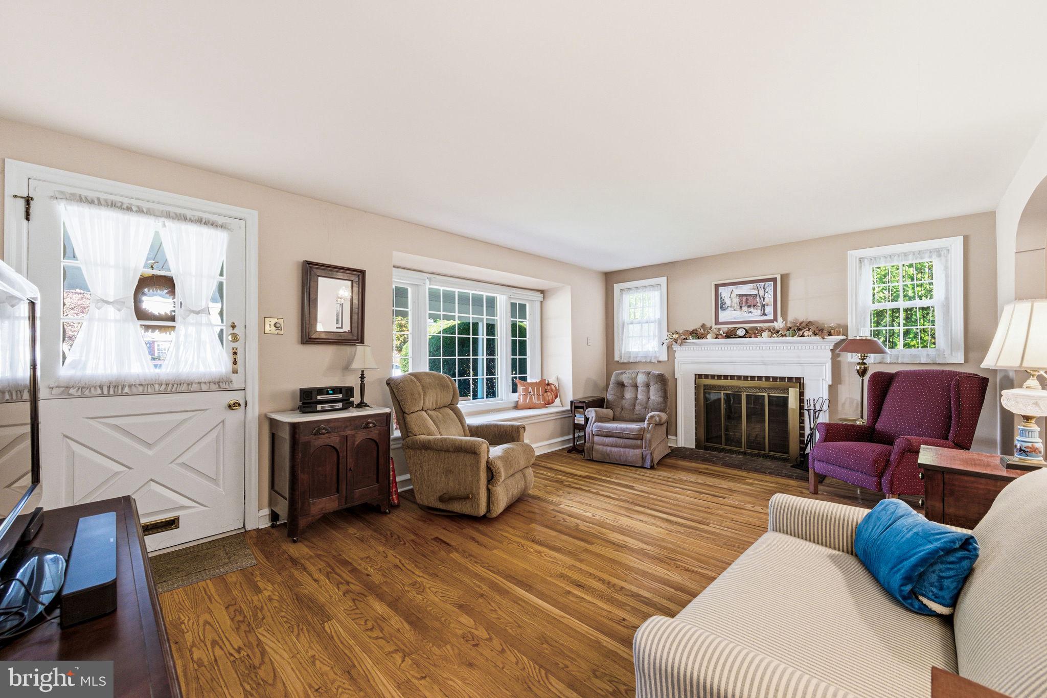 247 Orchard Road Springfield, PA 19064 - Photo 6 of 30 a living room with furniture fireplace and window