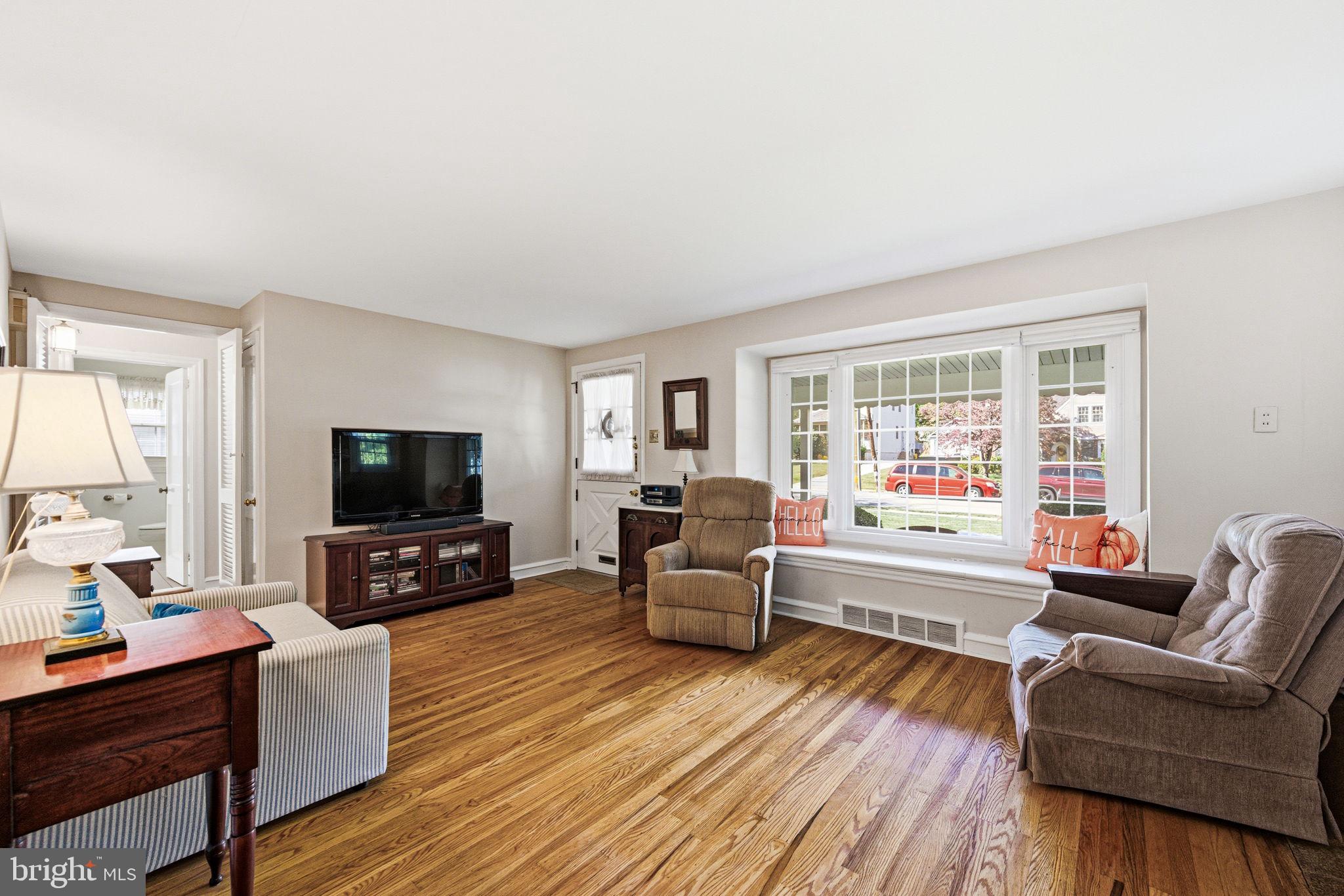 247 Orchard Road Springfield, PA 19064 - Photo 7 of 30 a living room with furniture and a flat screen tv