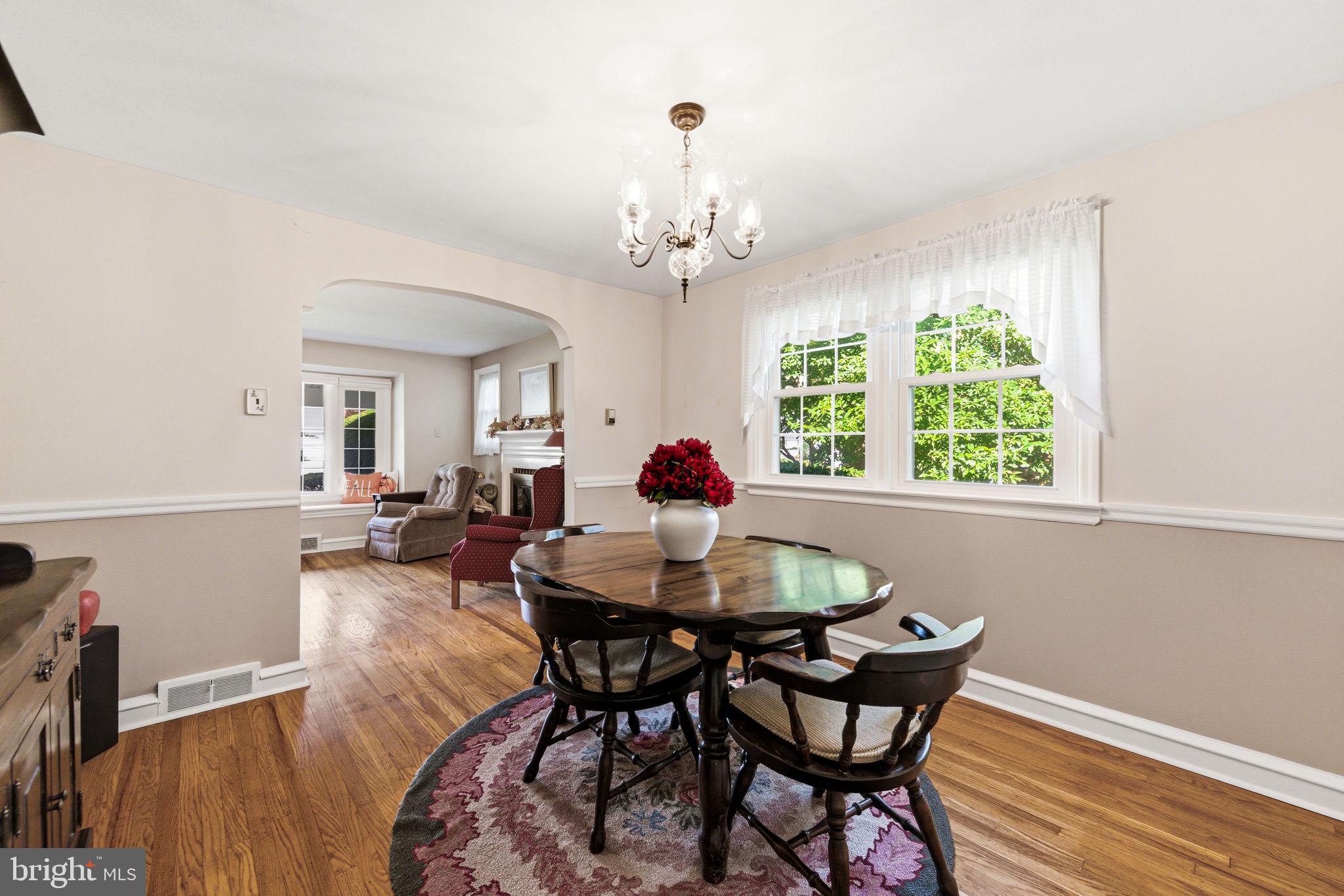 247 Orchard Road Springfield, PA 19064 - Photo 8 of 30 a dining room with furniture a window and wooden floor