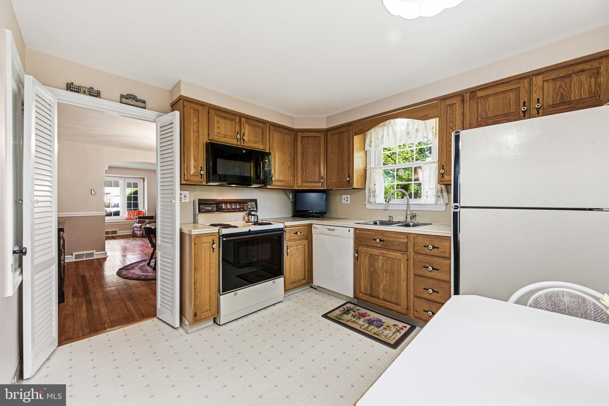 247 Orchard Road Springfield, PA 19064 - Photo 10 of 30 a kitchen with a refrigerator stove and sink