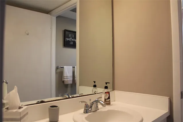 a bathroom with a sink and a mirror