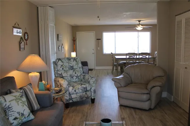 a living room with furniture and a lamp