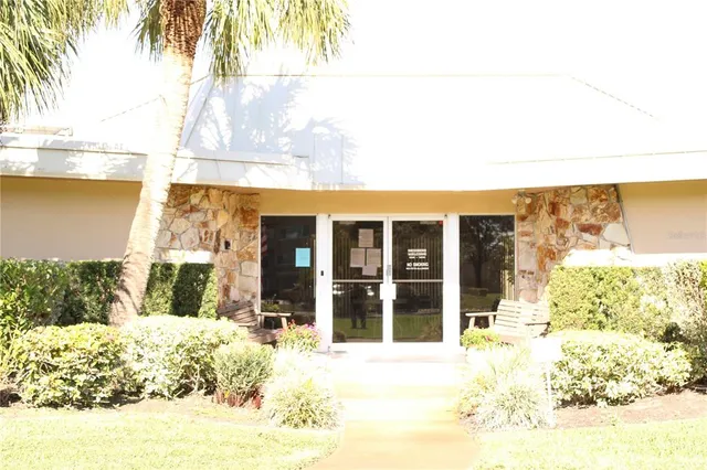 a view of a swimming pool with outdoor seating