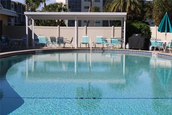 a view of a swimming pool with a patio
